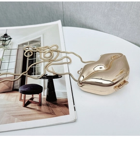 Mirror gold lip shaped hard shell evening bag with elegant metallic snake chain strap