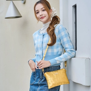 Modern gold crocodile embossed leather envelope crossbody bag for women with metal plaque