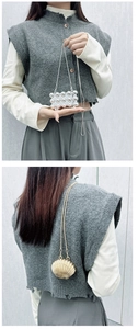 Mini acrylic star shell purse and silver spherical clutch bag with thin metal chain strap