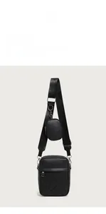 Close-up of quilted vertical phone bag with matching round coin pouch and silver hardware