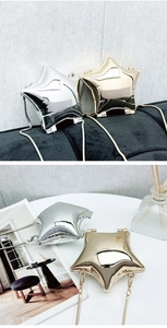 Close-up of star-shaped metallic shell bags in gold and silver with chain straps