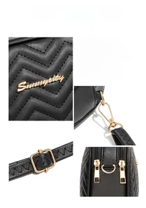 Detailed close-up of black quilted PU leather camera bag with premium gold-tone hardware