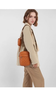Detailed vertical quilted crossbody bag in brown-orange PU leather with mini round coin pouch