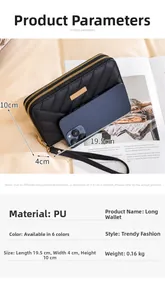 Detail of black quilted long wallet with double zippers and golden metal plate accent
