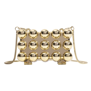 Mini gold acrylic star clutch bag with 3x5 metal spheres design and delicate chain
