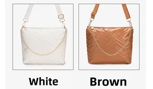 Detailed view of wave quilted bucket bag with gold chain and adjustable strap