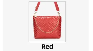Detail view of red quilted PU leather handbag with gold chain and fabric shoulder strap