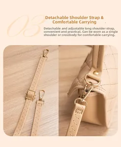 Detail of adjustable detachable beige leather shoulder strap with gold metal hooks