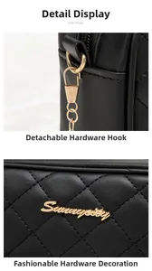 Close-up of black quilted camera bag showing the gold logo and metal hardware hooks