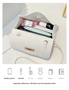 Interior view of white quilted crossbody bag showing storage capacity for daily essentials