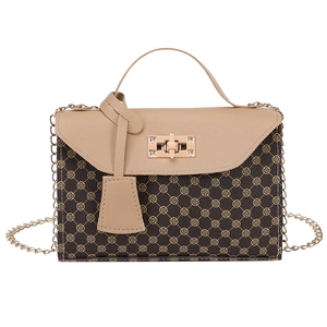 Vintage patterned crossbody bag with gold chain strap and earthy two-tone patchwork