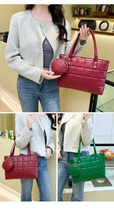 Detail of quilted tote bag set featuring gold rivet straps and matching coin purse