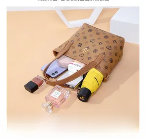 Detailed top view of a large capacity crossbody bag showing internal storage items