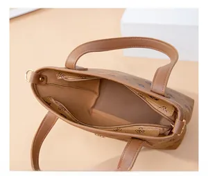Detailed top view of vintage brown monogram tote bag with metal zipper and spacious interior