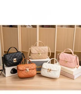Five assorted colors of quilted crossbody bags on display with leather straps