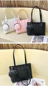 Detailed view of quilted tote bags in white, pink, and black with mini coin purses