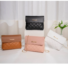 Close-up of quilted chain shoulder bags in multiple colors with gold metal logo