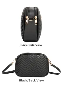 Detail view of black quilted crossbody bag showing side and back dual zipper compartments