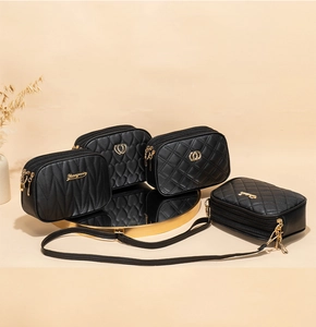 Detail showing four styles of black quilted PU leather crossbody bags with gold zippers