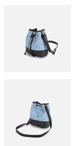 Detailansicht einer blauen Blumentasche mit schwarzem Leder-Kordelzug und Verschluss