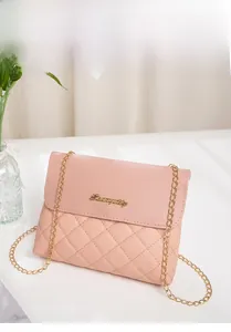 Detailed view of pink quilted shoulder bag featuring gold chain and metallic logo