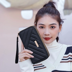 Women's black long wallet with V-shaped quilting, gold zipper, and wrist strap