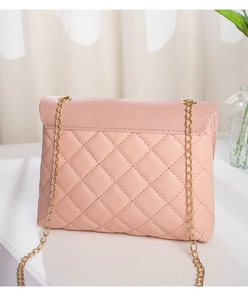 Detail of light pink quilted crossbody bag with gold chain strap and sewing texture