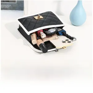 Interior view of a quilted leather crossbody bag showing large storage for daily items