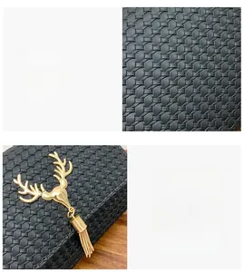 Close-up of black woven leather texture and golden deer head pendant with tassels