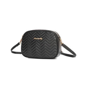 Black wave quilted camera bag with gold logo and dual zipper detail in crossbody style