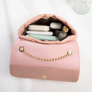Pink quilted crossbody bag for women with gold chain and organized inner space