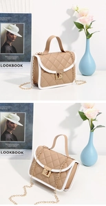 Detail of khaki quilted chain crossbody bag with white piping and golden hardware