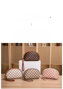 Detailed view of semi-circular checkered cosmetic pouches in four elegant colors