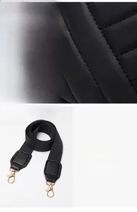 Detail of quilted leather texture and wide fabric shoulder strap with gold metal hooks