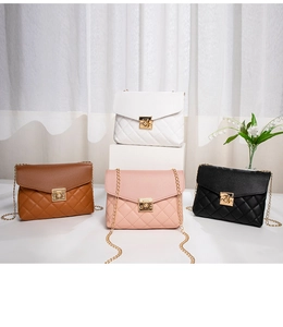 Quilted mini crossbody bags in white, pink, brown, and black with gold chain straps