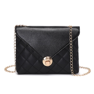 Elegant black quilted crossbody bag for women with gold chain strap and metal lock