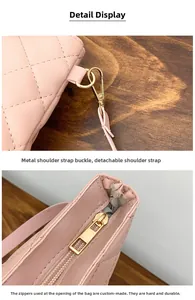 Detailed view of the gold hardware buckle and zip closure on the pink quilted bucket bag