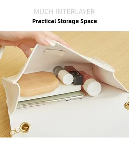 Detail view of white pebbled leather bag interior with ample space for daily essentials