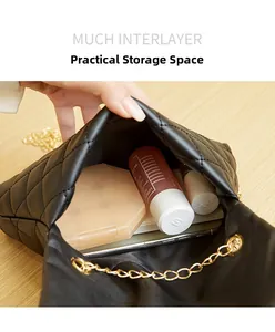 Internal storage detail of quilted leather chain bag with daily cosmetic essentials