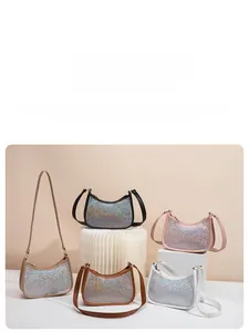 Glittering sequined shoulder bags in five colors shown on minimalist display stands