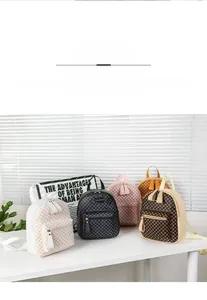 Detailed close-up of mini backpacks in five checkered patterns with faux leather texture