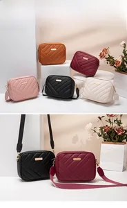 Close-up of quilted camera bags in five colors with wide woven straps and gold hardware