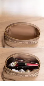 Detail of checkered pouch with wide opening showing cosmetics and large storage capacity