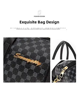 Detail of vintage Boston handbag featuring clover pattern and gold zinc alloy hardware