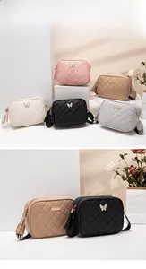 Detailed collection of quilted crossbody camera bags in various colors with ribbon straps