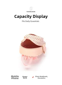 Top view of pink leather mini backpack showing interior capacity for daily essentials
