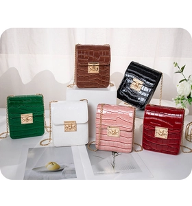 Detail display of mini crocodile embossed square bags in six elegant assorted colors