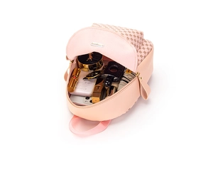 Detail showing internal storage capacity of the pink and beige mini backpack