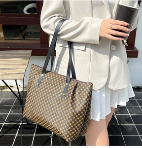 Detail of large tote bag with brown geometric circle pattern and sturdy metal rivets