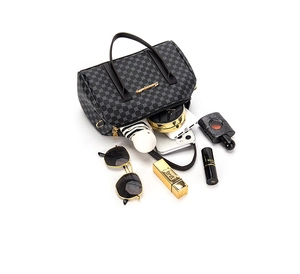 Top view of a vintage Boston handbag showing spacious interior and golden hardware